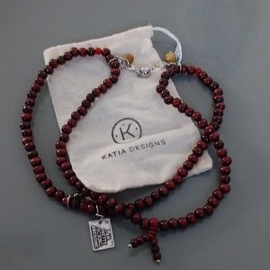 Katia designs red beaded necklace with tag saying I AM PRETTY F-CKING AWESOME